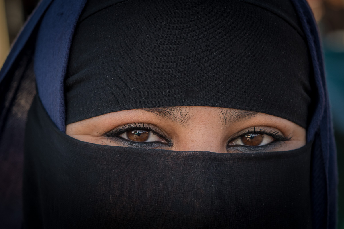 Jemaa el-Fna Square: local woman wears a niqab, a traditional Moroccan head covering